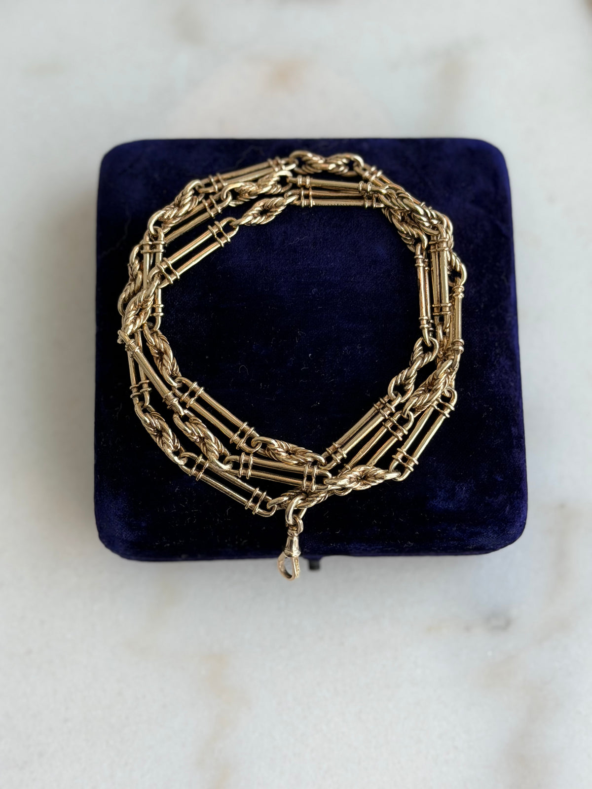 9CT GOLD TROMBONE & LOVER'S
KNOT LONG GUARD CHAIN