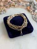 9CT GOLD TROMBONE & LOVER'S
KNOT LONG GUARD CHAIN