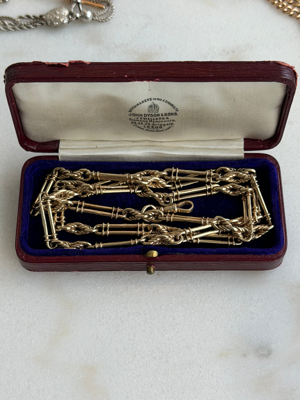 9CT GOLD TROMBONE & LOVER'S
KNOT LONG GUARD CHAIN