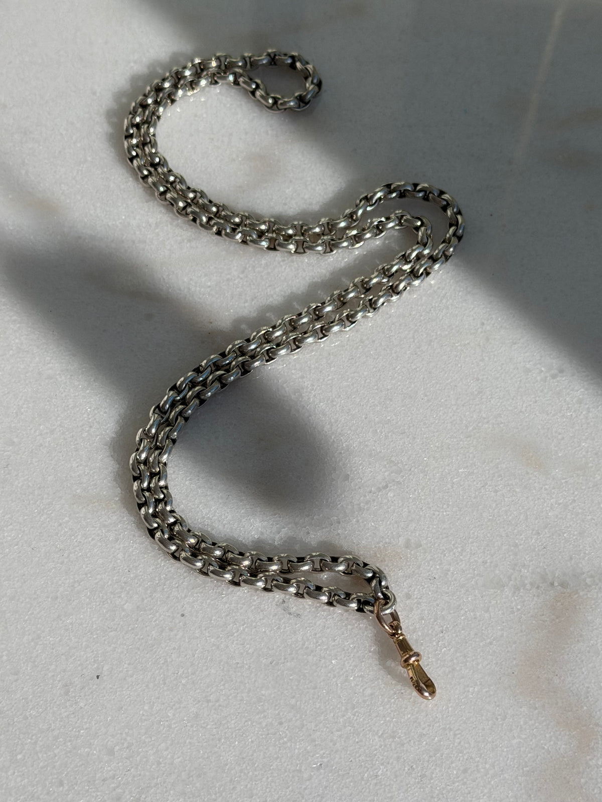 ANTIQUE SILVER GUARD CHAIN WITH 9CT GOLD DOG CLIP 28” 42gr.