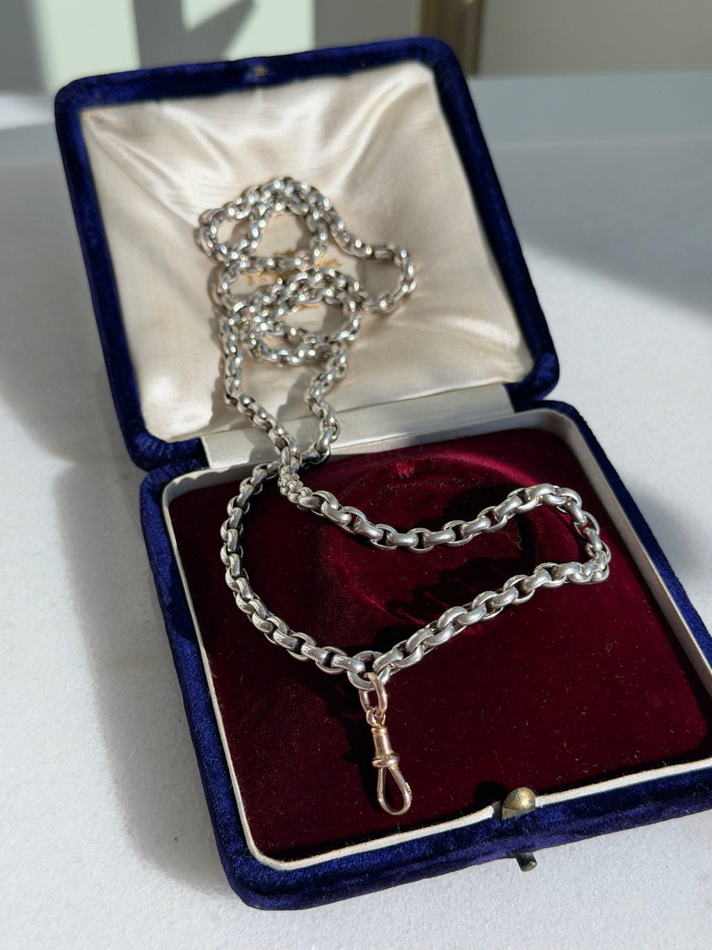 ANTIQUE SILVER GUARD CHAIN WITH 9CT GOLD DOG CLIP 28” 42gr.