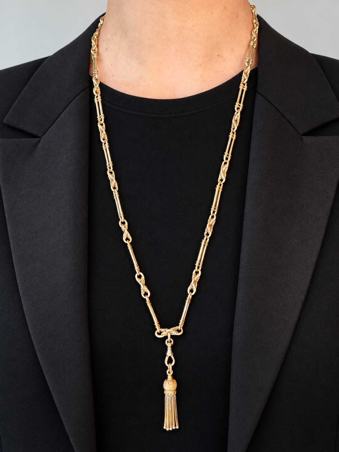 9CT GOLD TROMBONE & LOVER'S
KNOT LONG GUARD CHAIN