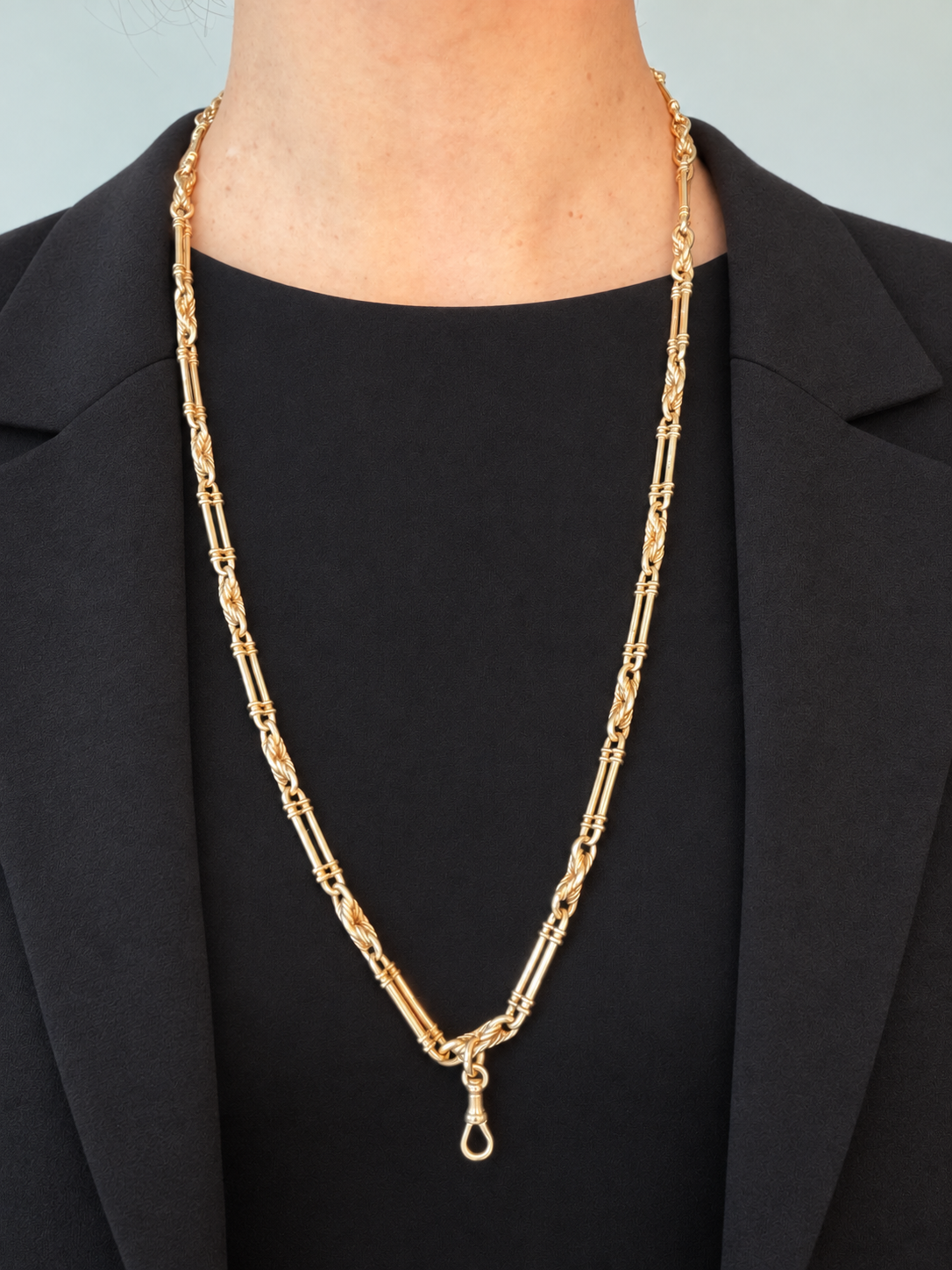 9CT GOLD TROMBONE & LOVER'S
KNOT LONG GUARD CHAIN