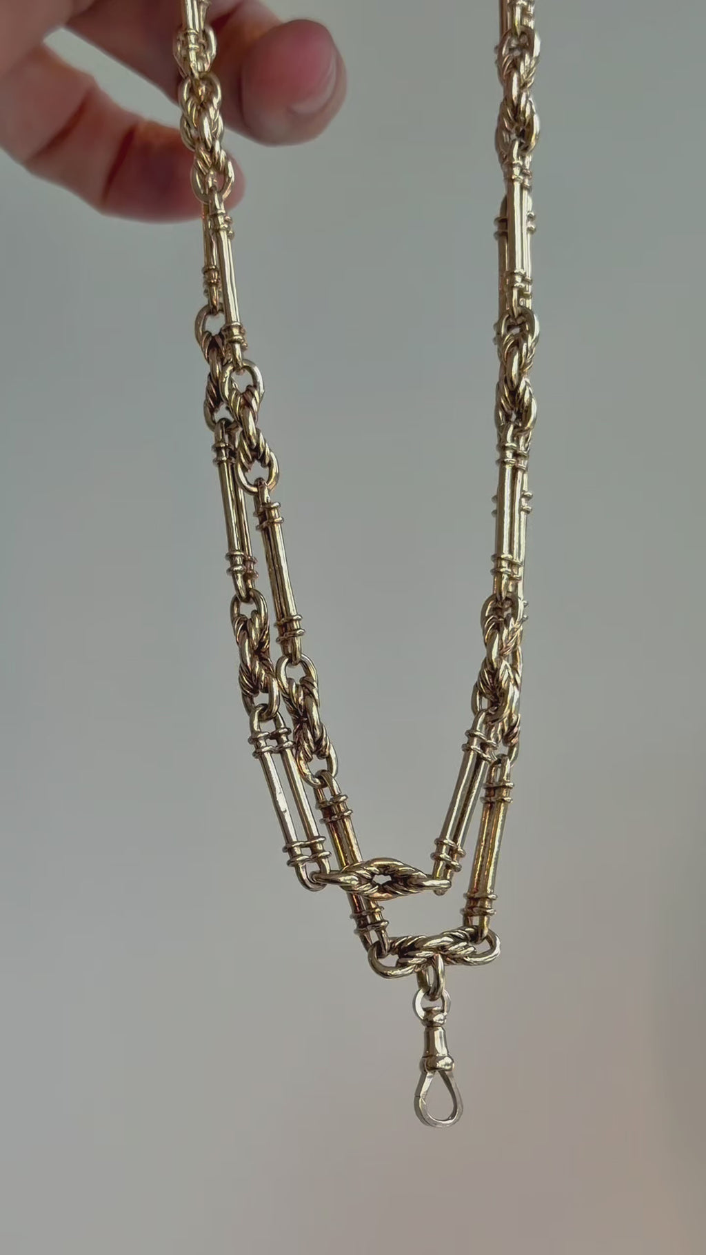 9CT GOLD TROMBONE & LOVER'S
KNOT LONG GUARD CHAIN